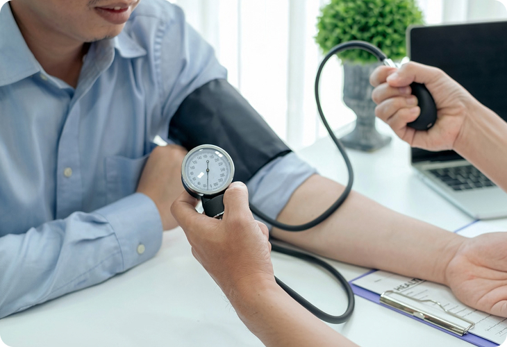 Clinician measuring a patient's blood pressure
