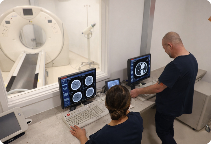Radiographer preparing a patient for a diagnostic scan
