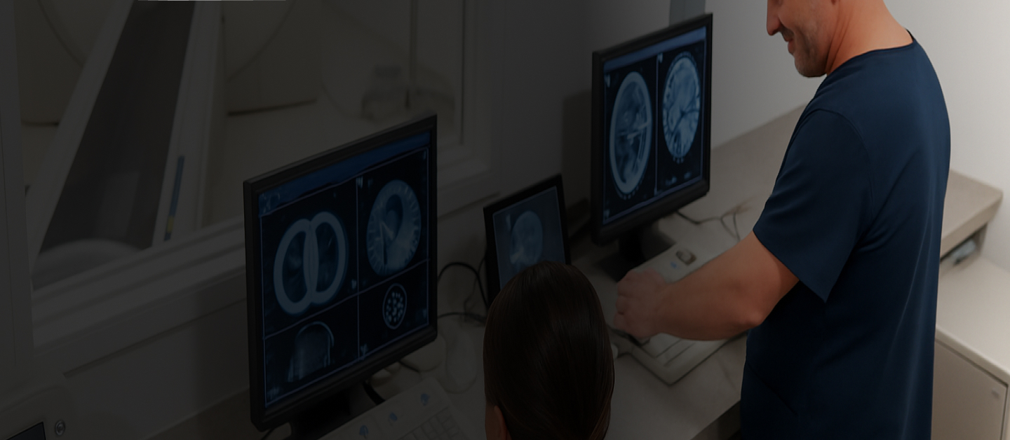 Medical imaging professional reviewing scans